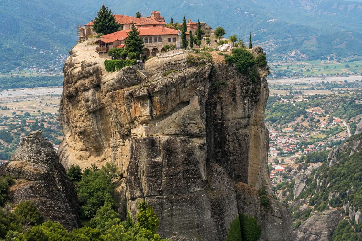Scenic view of Roussanou Monastery featuring centuries-old stone architecture and spectacular cliff-top scenery during a guided tour with Meteora Tours